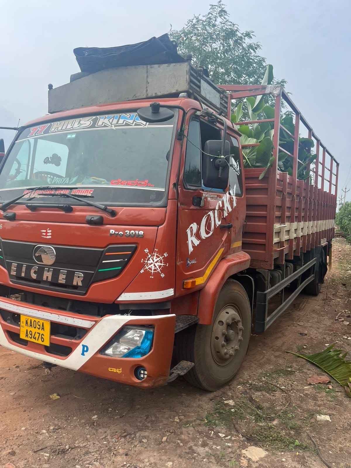 Truck loaded high with palms at Karthikeya Nursery Gardens, Kadiyam